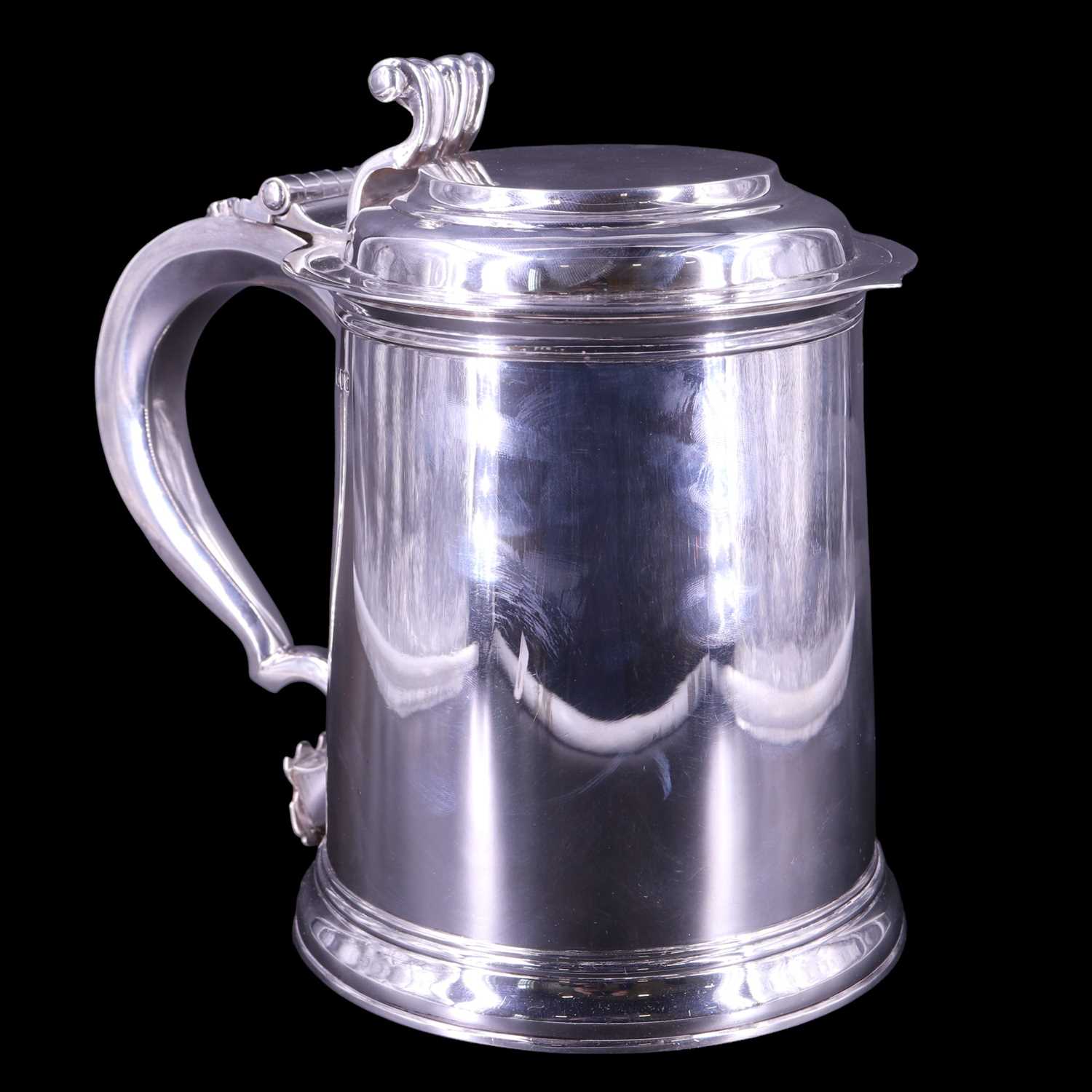Lot 902 - An Edwardian oversized silver lidded tankard...