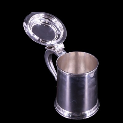Lot 902 - An Edwardian oversized silver lidded tankard...