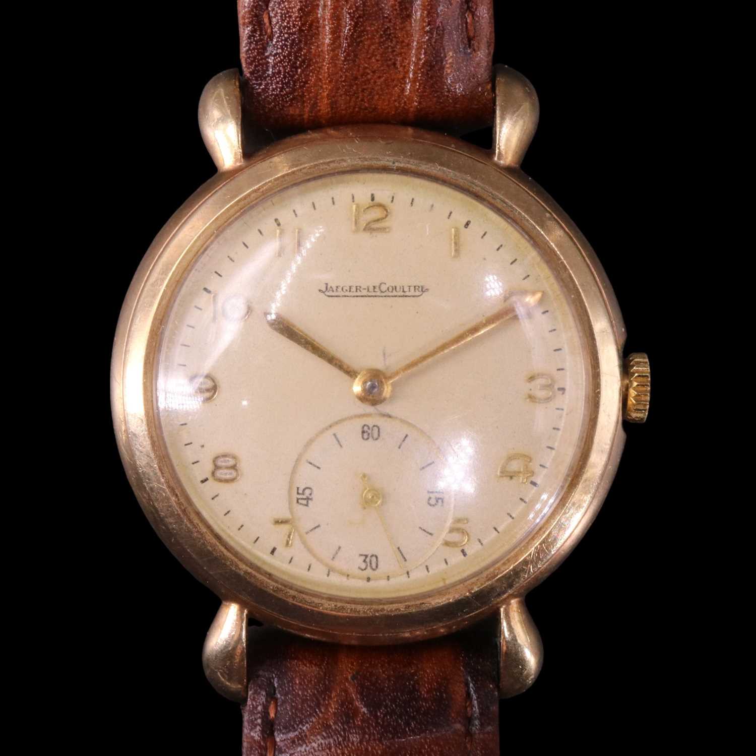 Lot 1558 - A 1950s Jaeger-LeCoultre 9 ct gold wristwatch...