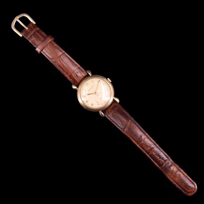 Lot 1558 - A 1950s Jaeger-LeCoultre 9 ct gold wristwatch...