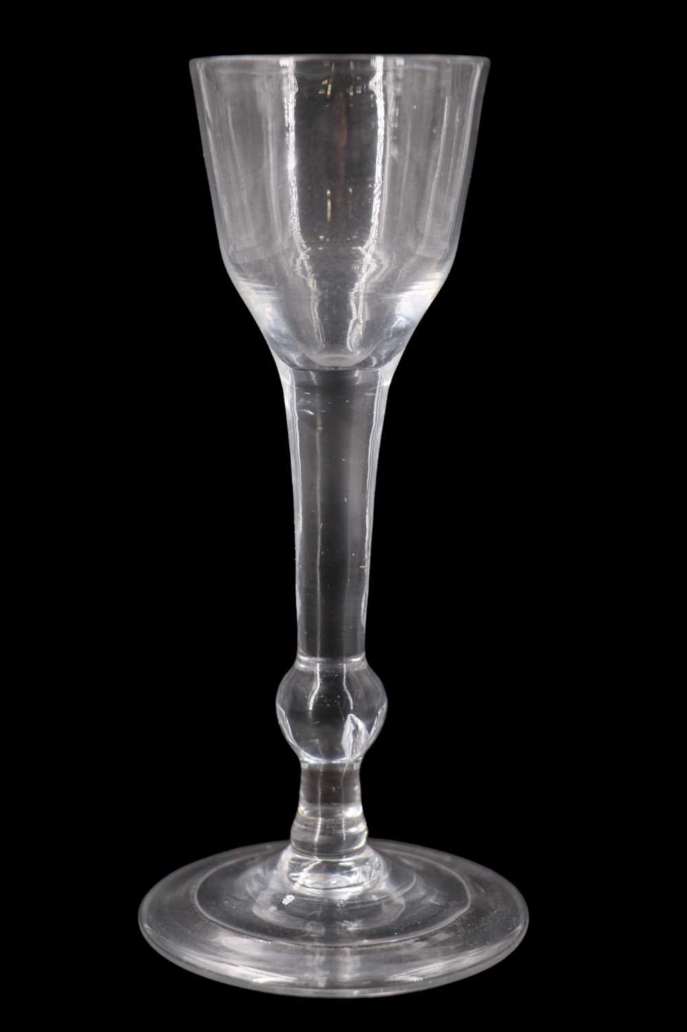 Lot 1388 - A mid 18th Century balustroid wine or cordial...