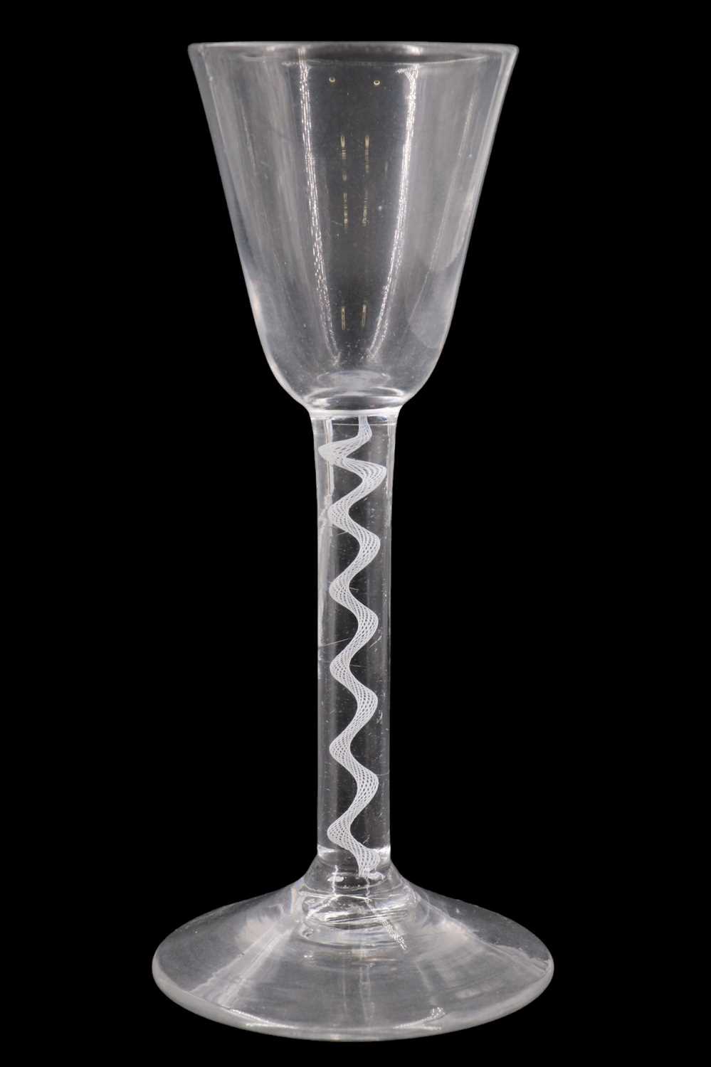Lot 1383 - A mid 18th Century opaque twist wine glass,...