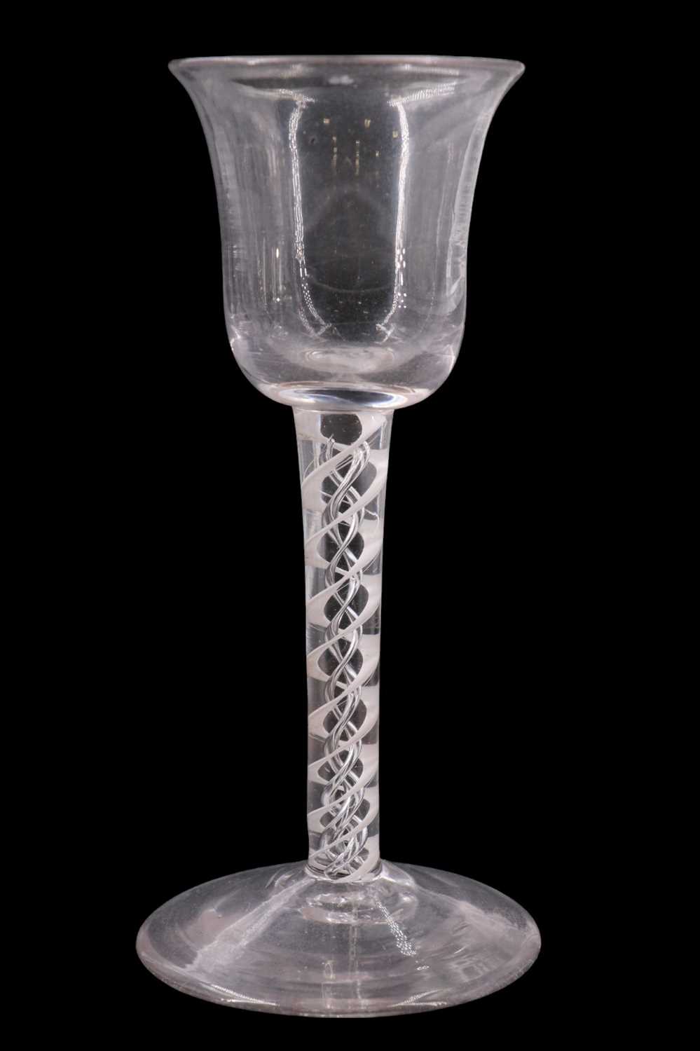 Lot 1381 - A mid 18th Century mixed twist stemmed wine...