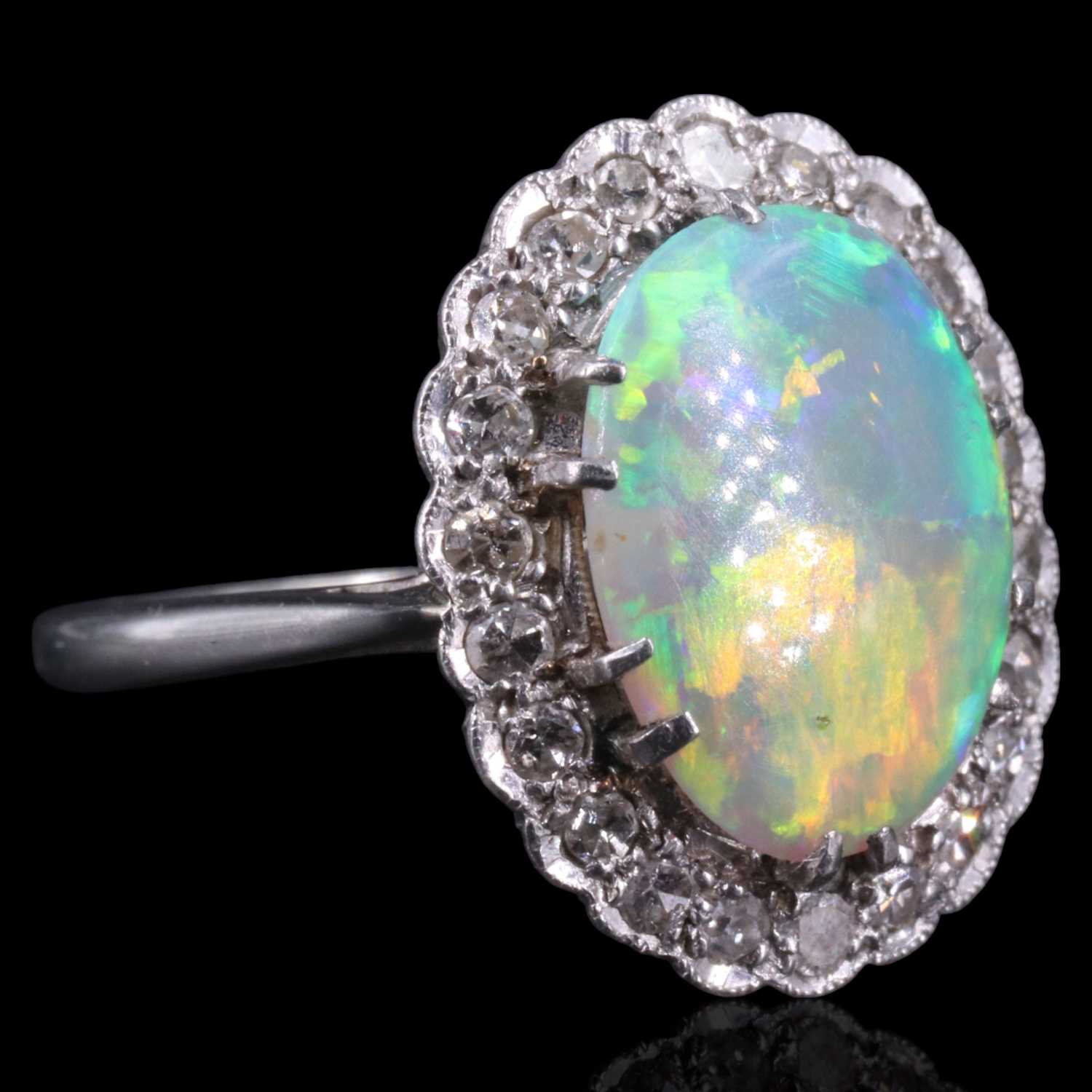 Lot 1108 - A very fine opal and diamond cluster ring...