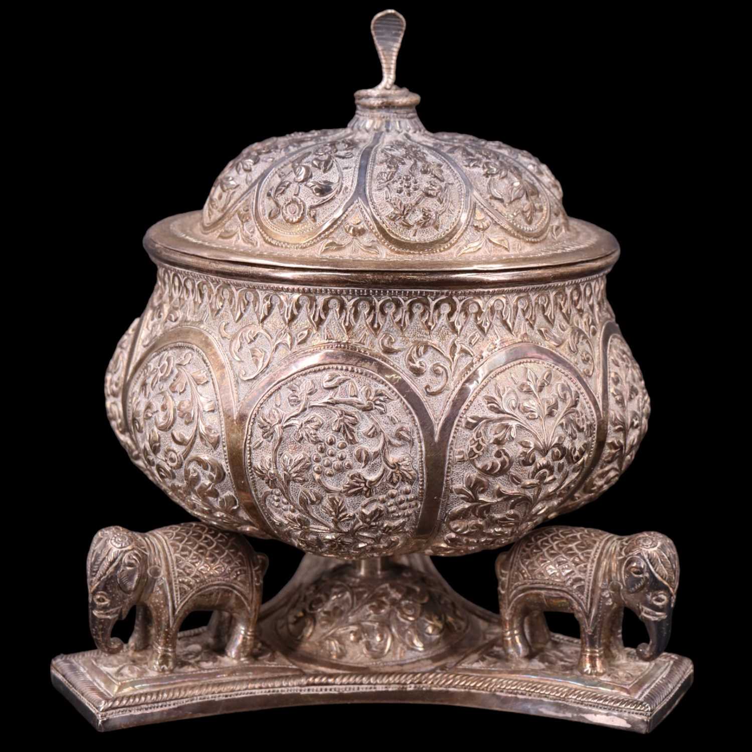 Lot 1039 - An Indian / South Asian white metal lidded...