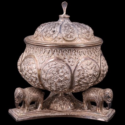 Lot 1039 - An Indian / South Asian white metal lidded...