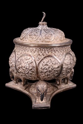Lot 1039 - An Indian / South Asian white metal lidded...