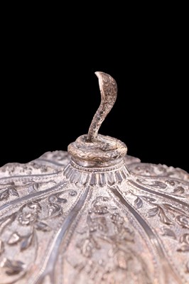 Lot 1039 - An Indian / South Asian white metal lidded...