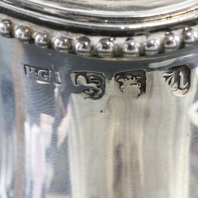 Lot 1043 - A George III silver claret jug or ewer, of...