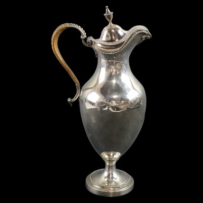 Lot 1043 - A George III silver claret jug or ewer, of...