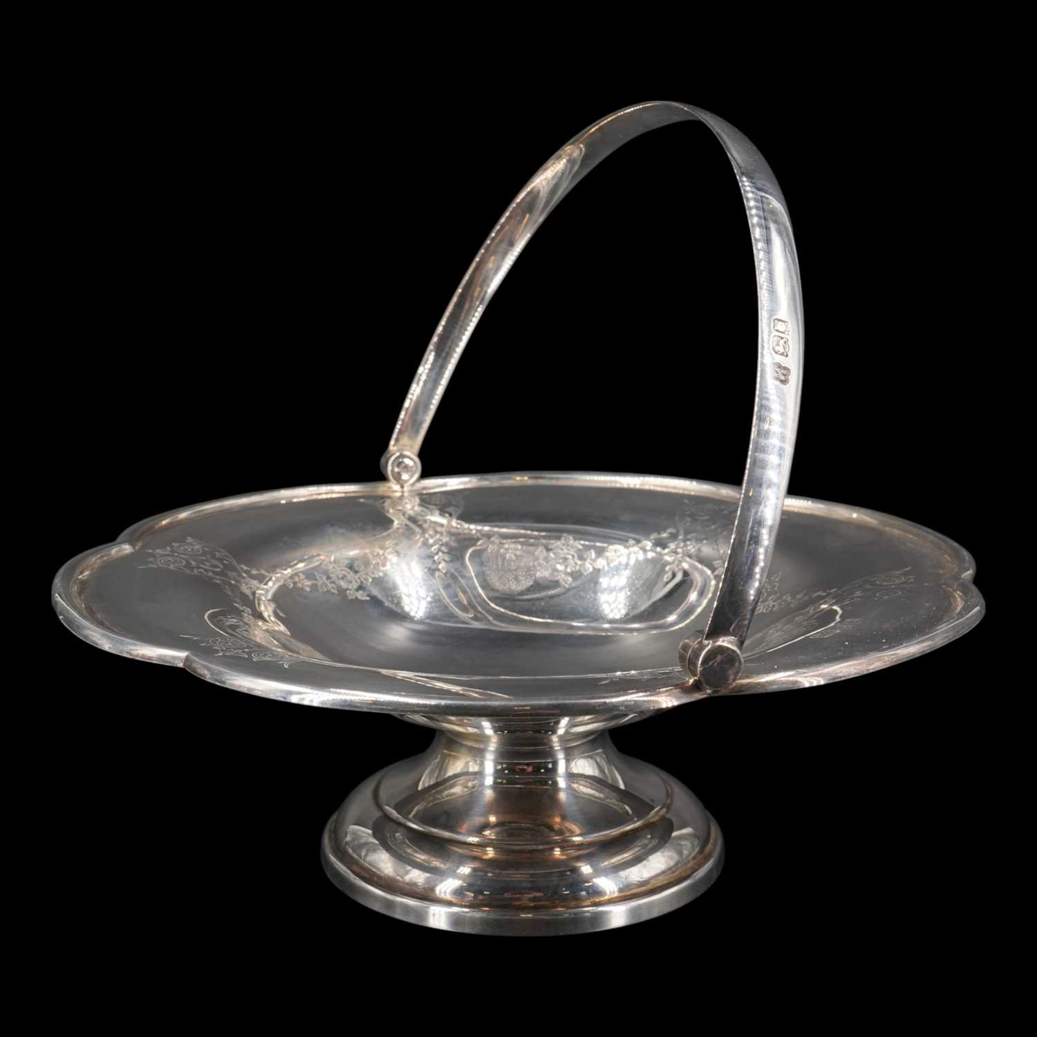 Lot 1126 - A George V silver swing-handled footed dish,...