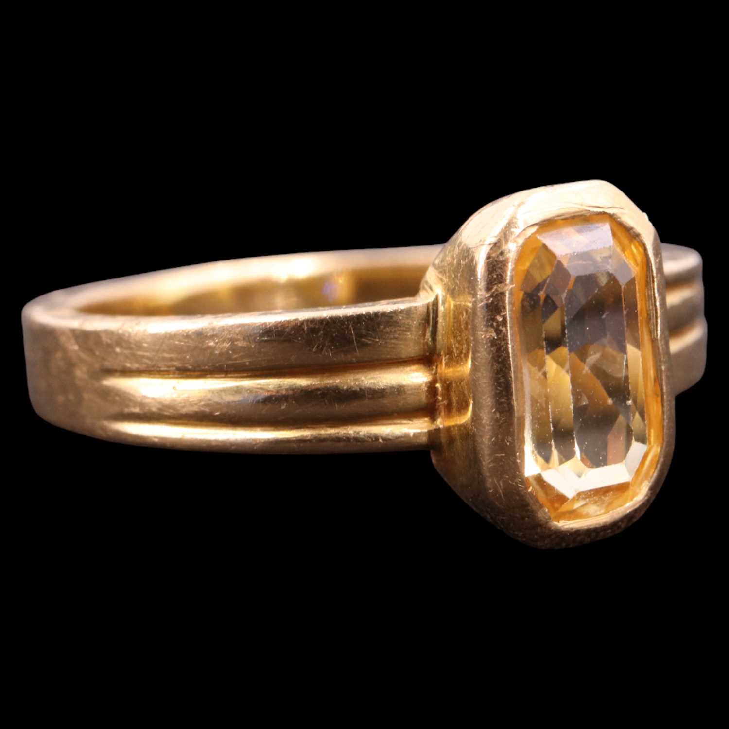 Lot 1297 - A contemporary yellow sapphire / topaz and 22...