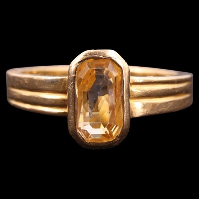Lot 1297 - A contemporary yellow sapphire / topaz and 22...