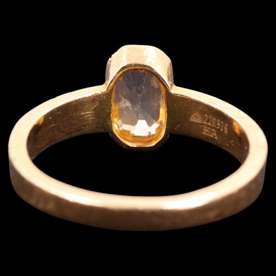 Lot 1297 - A contemporary yellow sapphire / topaz and 22...