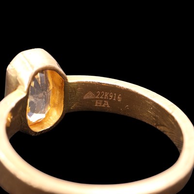 Lot 1297 - A contemporary yellow sapphire / topaz and 22...