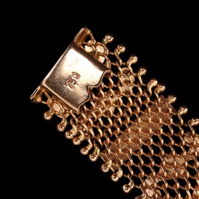 Lot 1391 - An Egyptian 18 ct yellow metal mesh bracelet,...