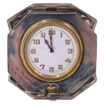 Lot 1551 - A 1920s silver travel clock, having an 8-day...