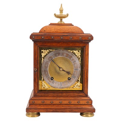 Lot 1535 - A Victorian brass-mounted oak bracket clock by...