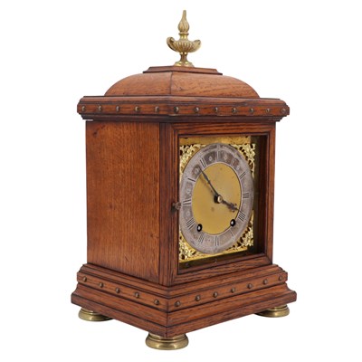 Lot 1535 - A Victorian brass-mounted oak bracket clock by...