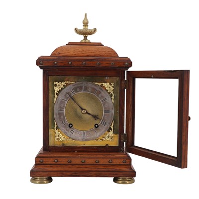Lot 1535 - A Victorian brass-mounted oak bracket clock by...