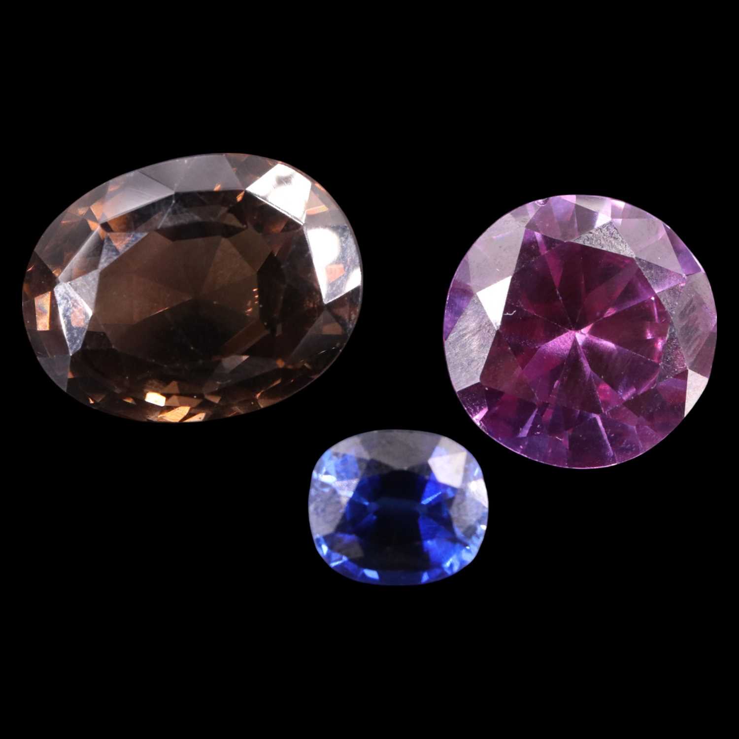 Lot 1383 - Large unmounted facet-cut ruby, sapphire and...