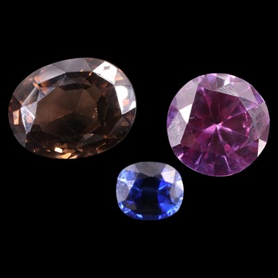 Lot 1383 - Large unmounted facet-cut ruby, sapphire and...