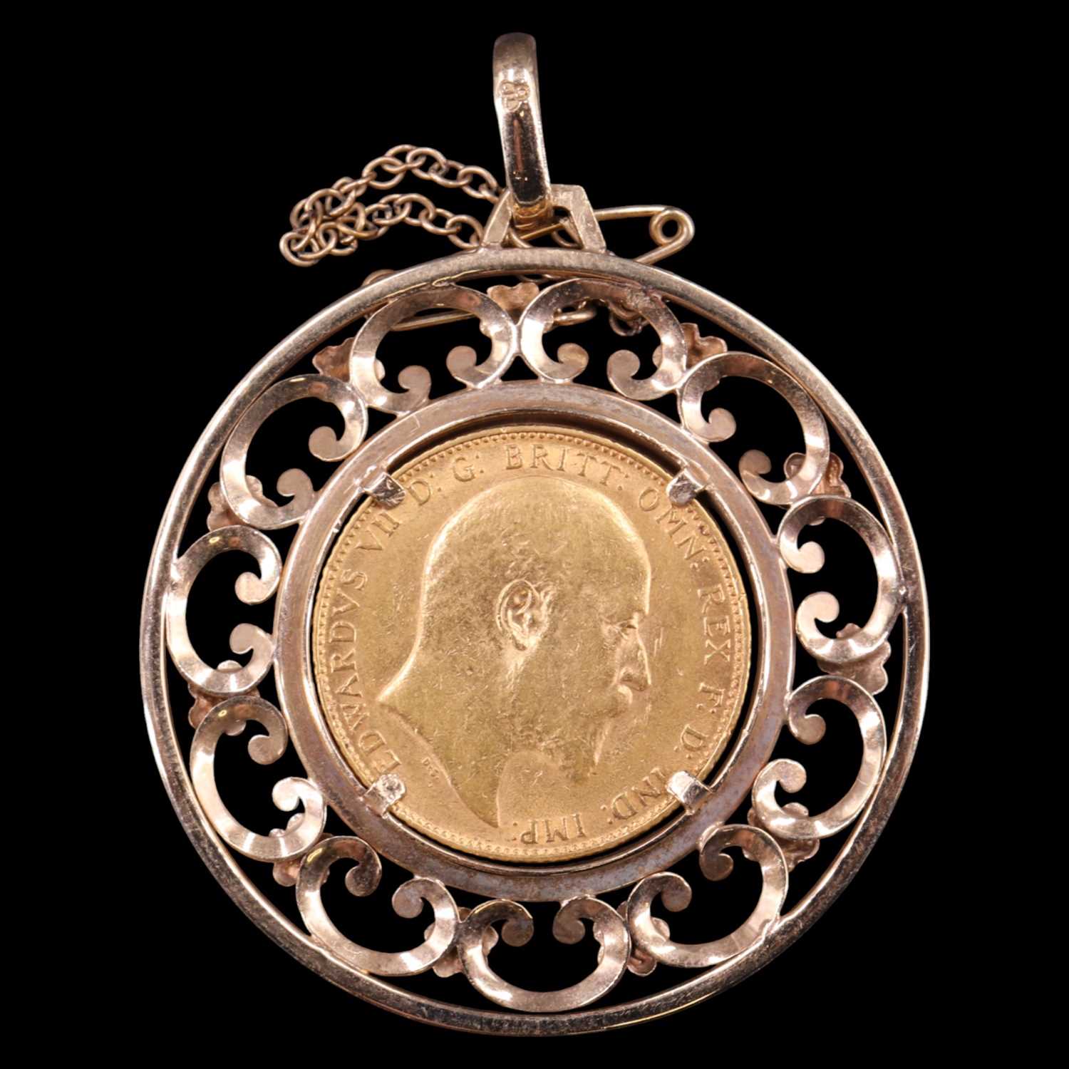 Lot 1716 - A 1910 gold sovereign in a large 9 ct gold...