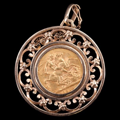 Lot 1716 - A 1910 gold sovereign in a large 9 ct gold...