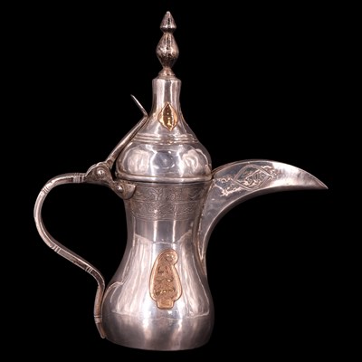 Lot 1178 - A Middle Eastern white metal dallah coffee pot,...