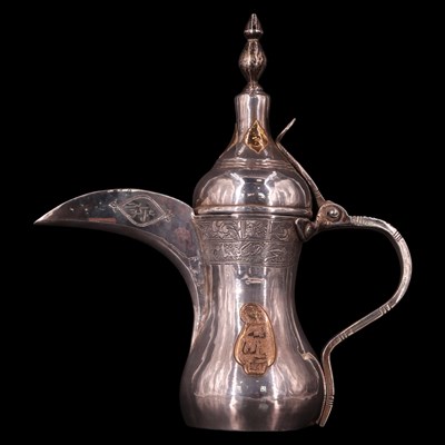 Lot 1178 - A Middle Eastern white metal dallah coffee pot,...