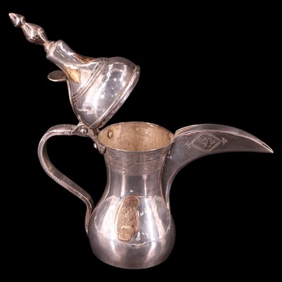 Lot 1178 - A Middle Eastern white metal dallah coffee pot,...