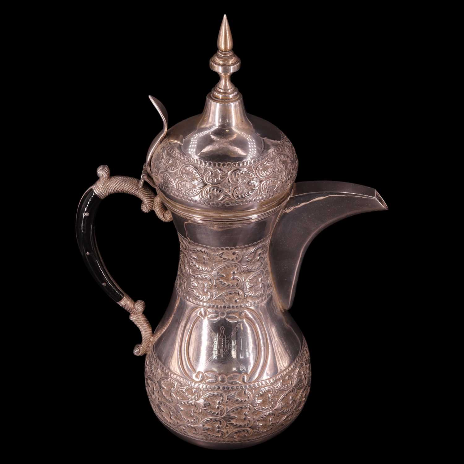 Lot 1179 - A Middle Eastern white metal dallah coffee pot,...
