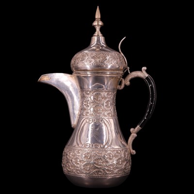 Lot 1179 - A Middle Eastern white metal dallah coffee pot,...