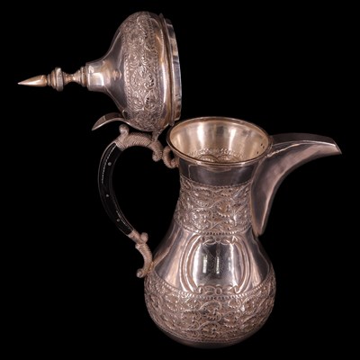 Lot 1179 - A Middle Eastern white metal dallah coffee pot,...