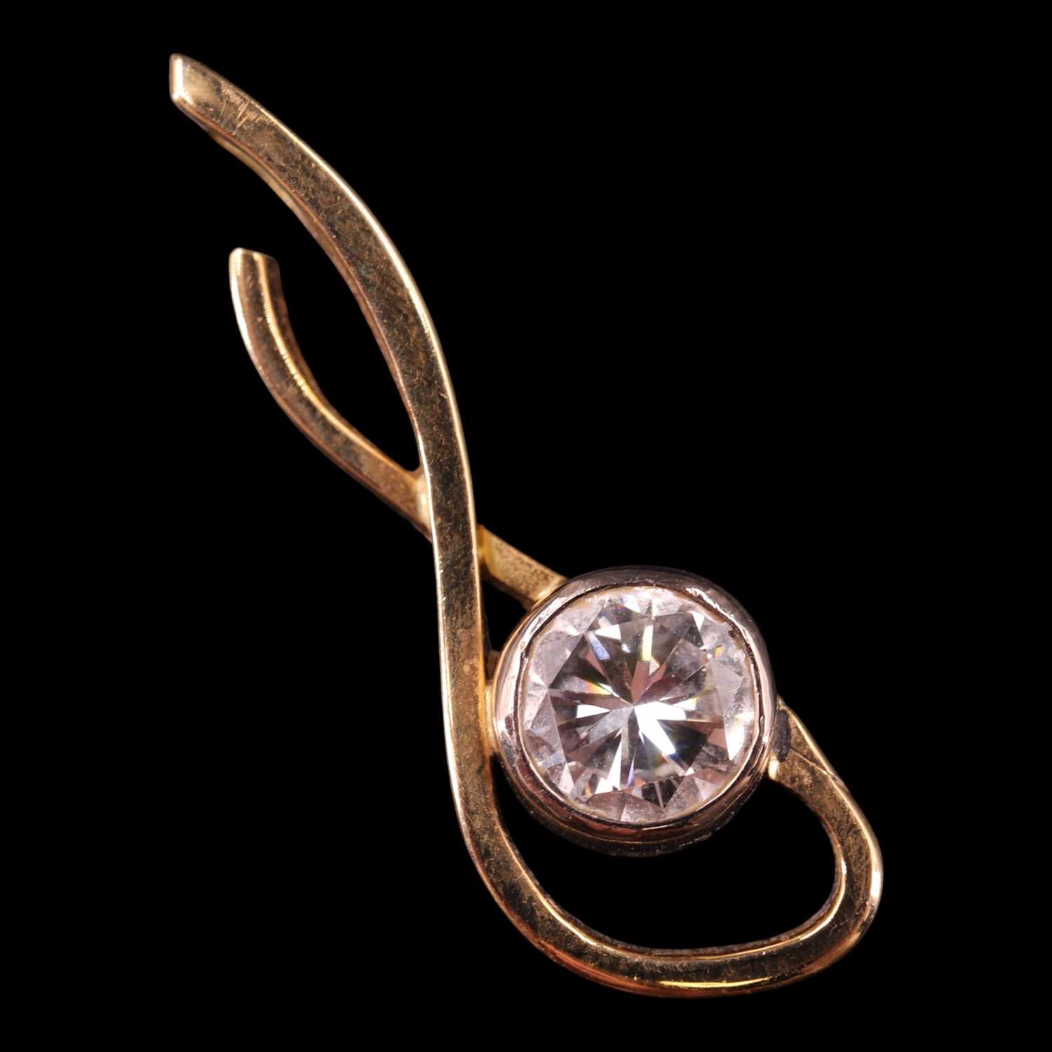 Lot 1486 - A contemporary diamond and 18 ct gold scroll...