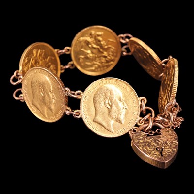 Lot 1613 - Six gold sovereigns hard mounted in bracelet...