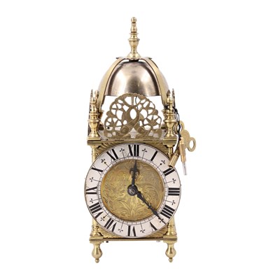 Lot 1673 - A miniature "lantern" clock, circa 1930s, 23 cm