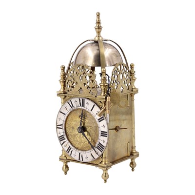 Lot 1673 - A miniature "lantern" clock, circa 1930s, 23 cm