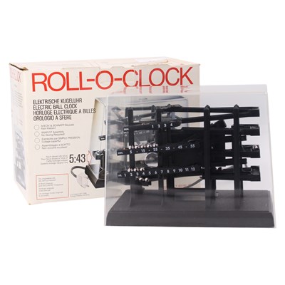 Lot 1667 - A boxed 1970s German Roll-O-Clock electric...