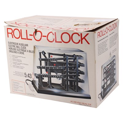 Lot 1667 - A boxed 1970s German Roll-O-Clock electric...