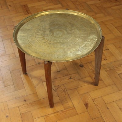 Lot 1595 - An Arabic / Indo-Persian brass tray-topped...