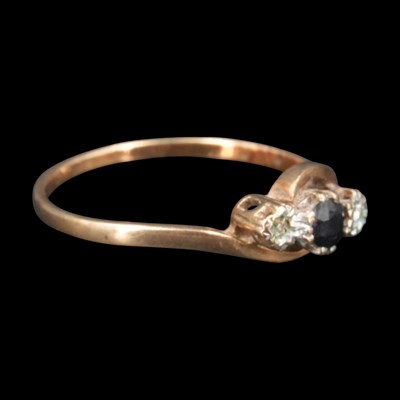 Lot 1221 - A near-contemporary twist-set three-stone...