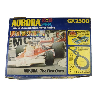 Lot 883 - An Aurora AFX GX2500 slot car racing set with...