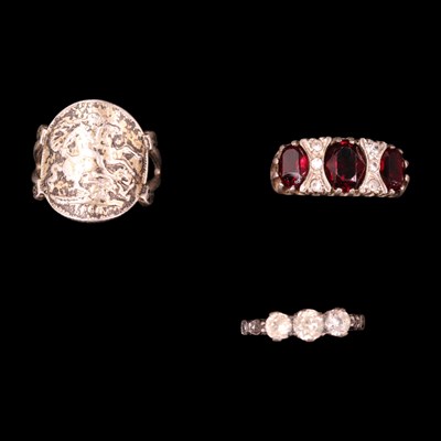 Lot 1224 - Three vintage white and yellow metal rings,...