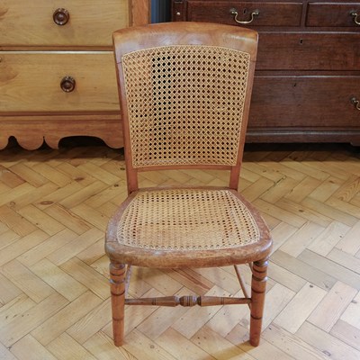 Lot 1599 - A late Victorian carved walnut nursing or...