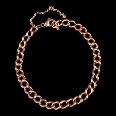 Lot 1240 - A vintage 9 ct rose-coloured yellow metal curb-...