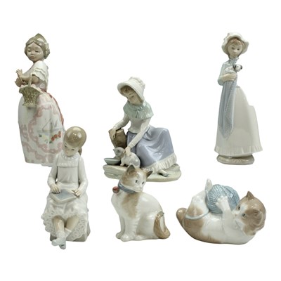 Lot 1122 - A group of six Nao porcelain figurines,...
