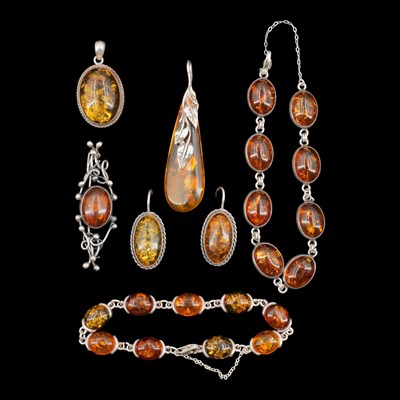 Lot 1263 - A group of white-metal-mounted Baltic amber...