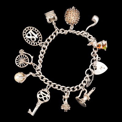 Lot 1264 - A vintage silver charm bracelet, 40 g