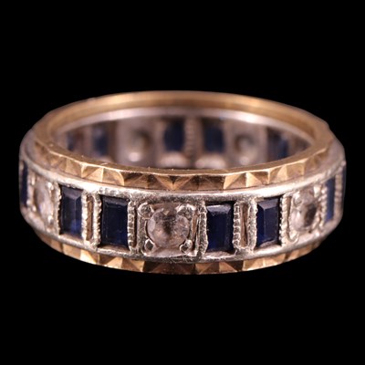 Lot 1266 - A silver and 9 ct yellow metal eternity...